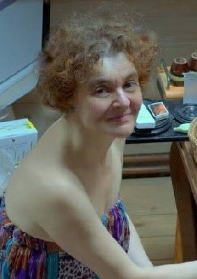 T.